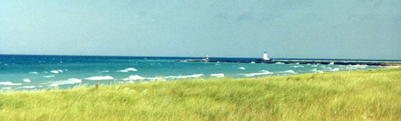 A bright, windy day with waves crashing.